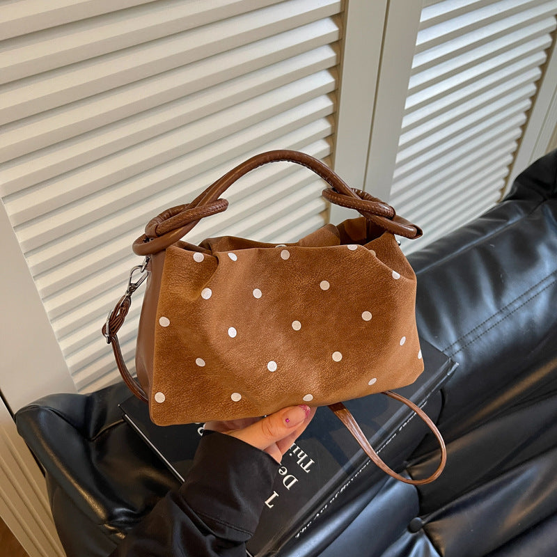 Verspielt gepunktete Handtasche