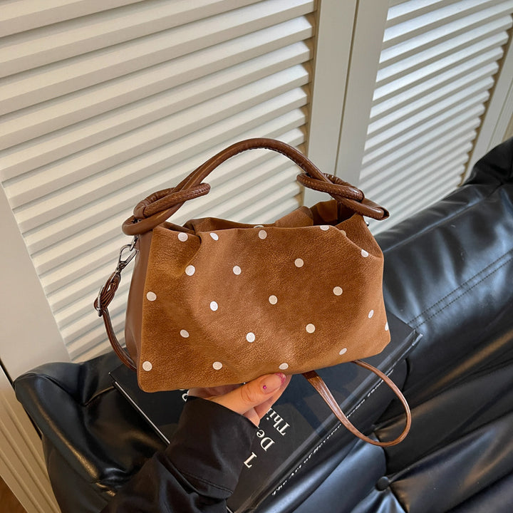 Verspielt gepunktete Handtasche