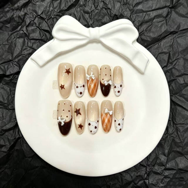 Dekoratives Press-On Nagelkunstset mit einzigartigen Bogen- und Stern-Designs
