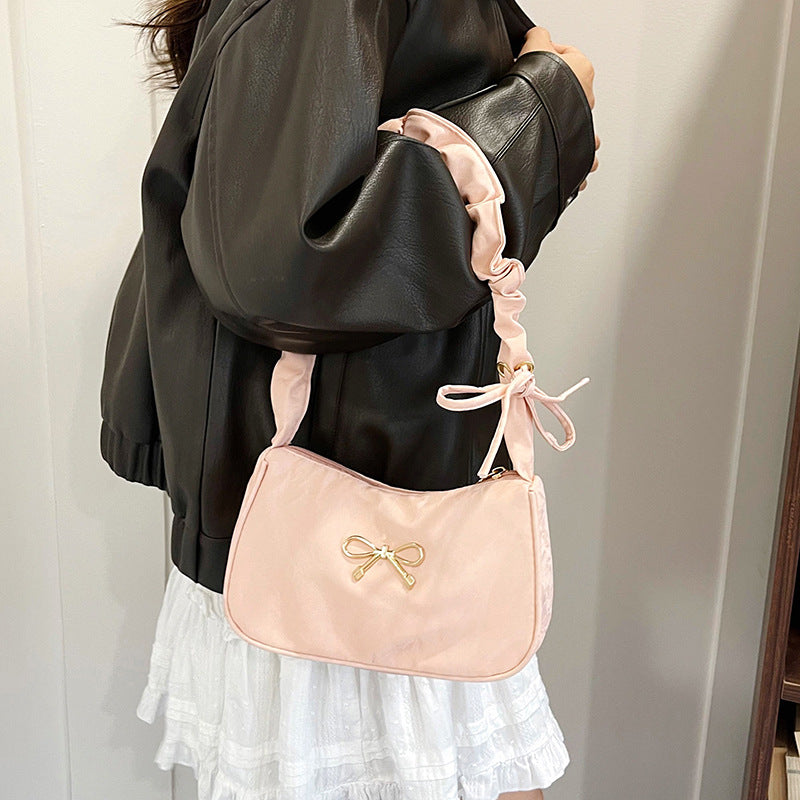Elegante Schultertasche mit Schleifenverzierung