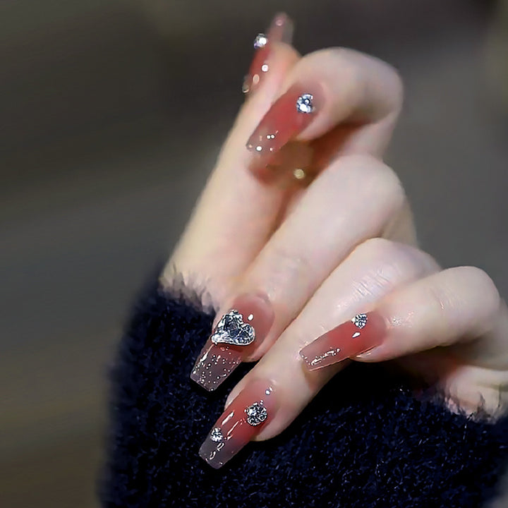 Kunstnagelset mit eleganten Herz- und Strassverzierungen Karnz