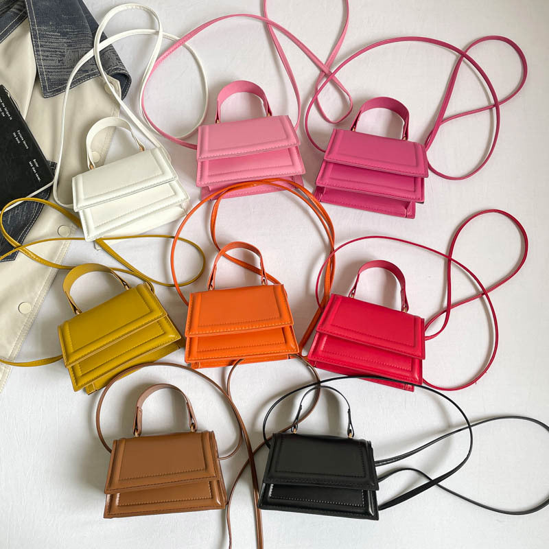 Strukturierte Mini-Crossbody-Handtasche