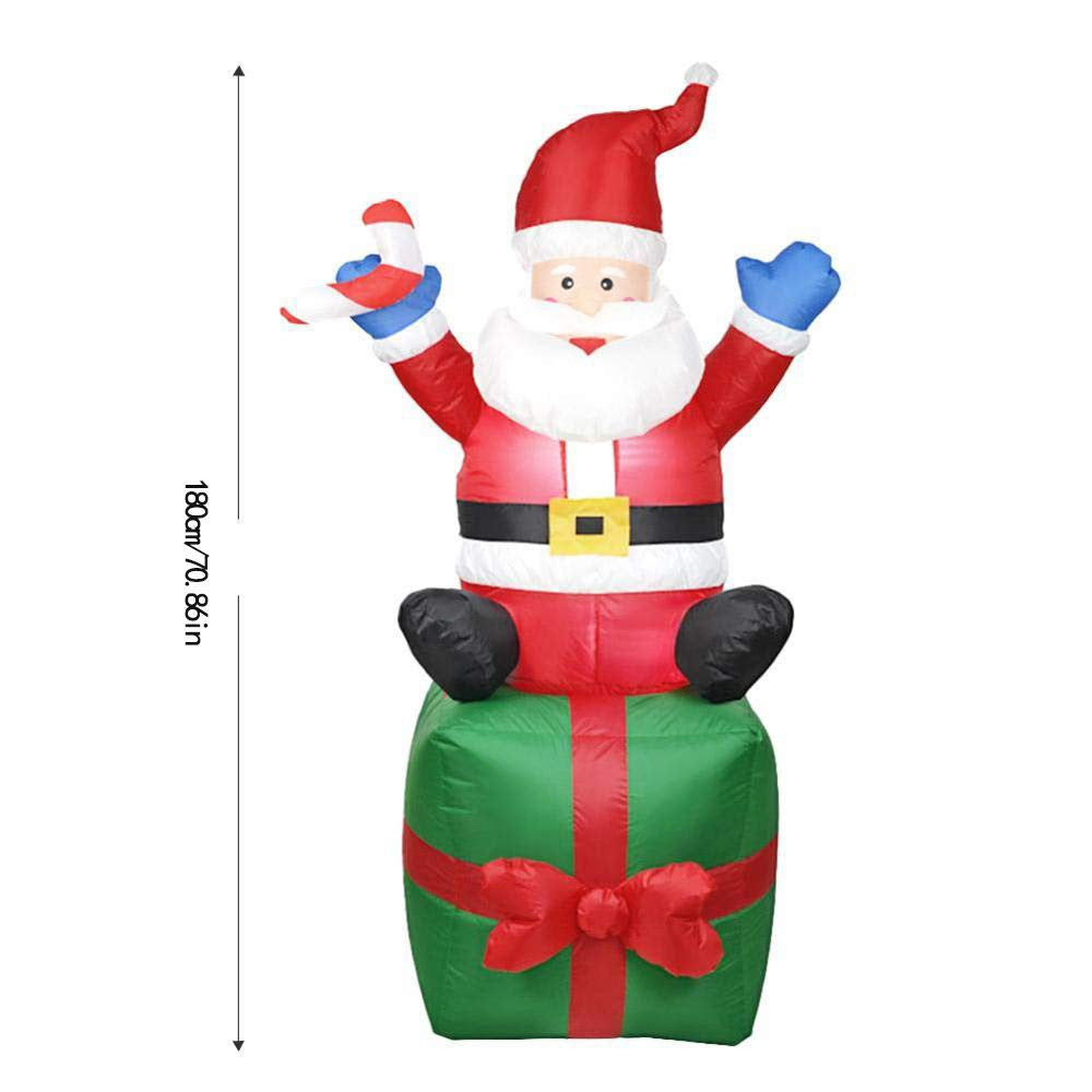 Aufblasbare Weihnachtsmann-Dekorationsfigur auf Geschenkpaket
