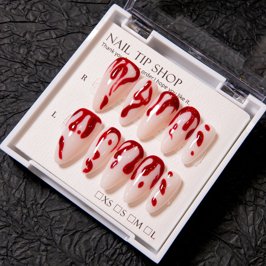Künstlerisches Press-On Nagelset mit Blutspritzdesign