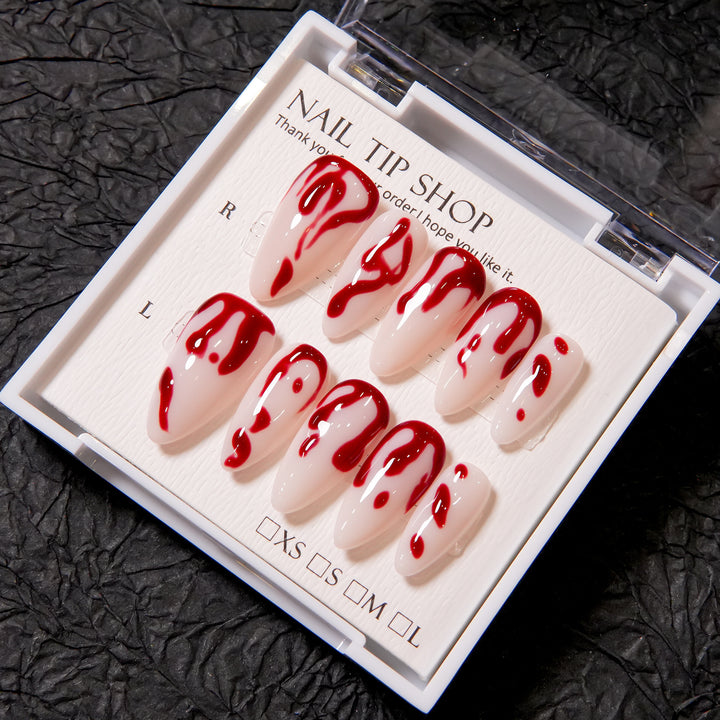 Künstlerisches Press-On Nagelset mit Blutspritzdesign