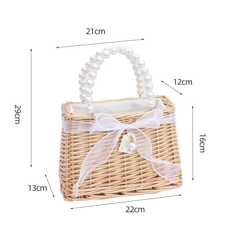 Damen Handtasche aus geflochtenem Material mit eleganten Perlengriffen Karnz