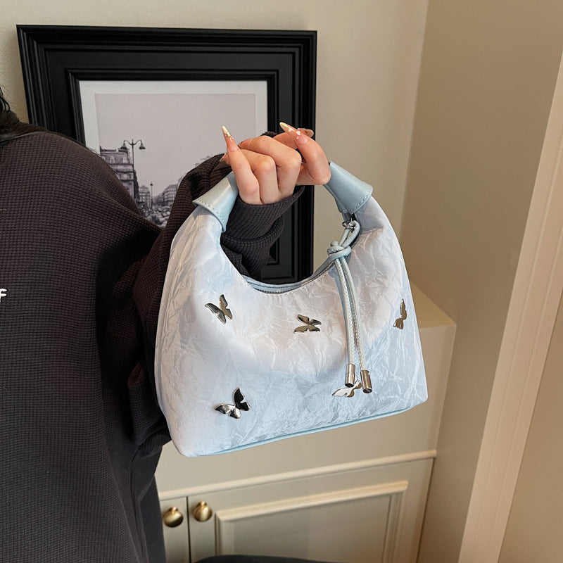 Stylische Handtasche mit Schmetterlingsdetail Karnz