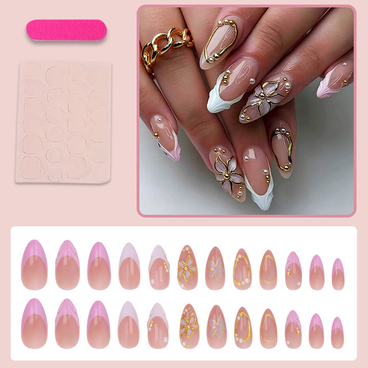Kunstnagelset mit floralen und glitzernden Verzierungen Karnz