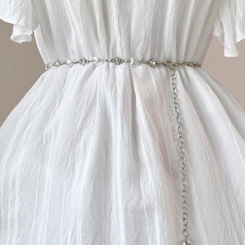Elegante Kette mit Perlen und Herzanhängern Karnz
