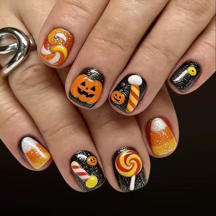 Halloween Kunstnagelset mit verspielten Kürbis- und Süßigkeitenmotiven Karnz