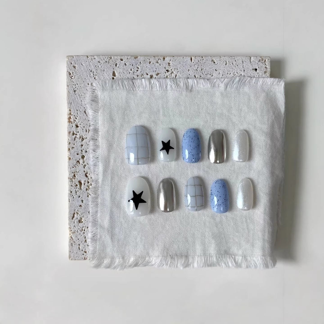 Künstlerisches Press-On-Nagelset mit geometrischen und Sternmustern
