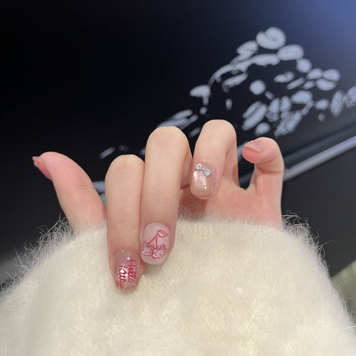 Dekoratives Press-On Nagelkunstset mit Kirschen- und Schleifenakzenten Karnz