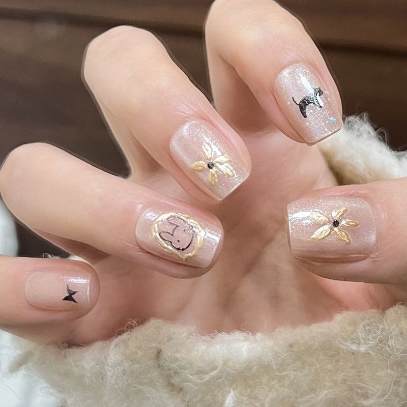 Dekoratives Press-On-Nagelset mit Stern- und Schleifenmotiven Karnz