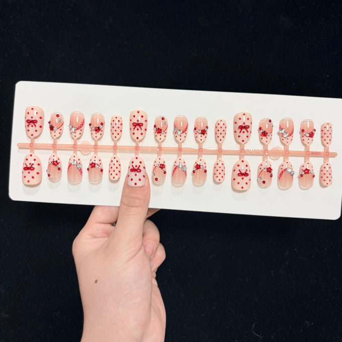 Dekoratives Press-On-Nagelset mit Stern- und Schleifenmotiven Karnz