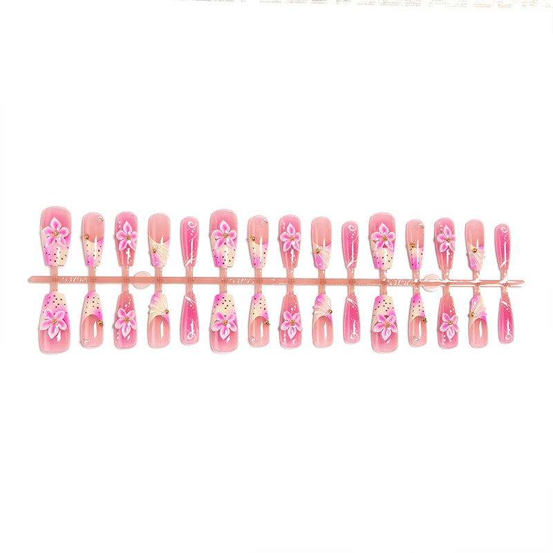 Kunstnagelset mit eleganten Blütenmotiven Karnz