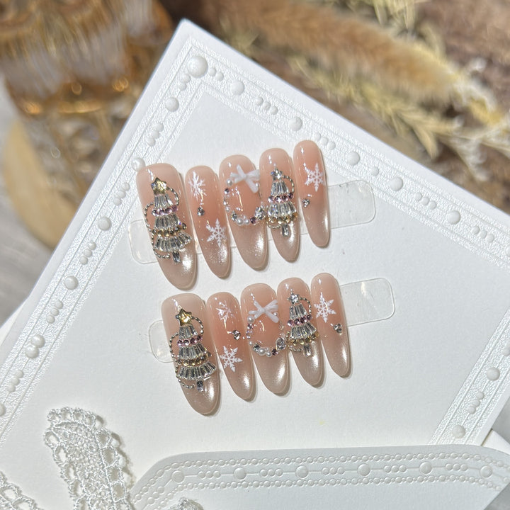 Dekoratives Stiletto Press-On Nagelkunst-Set mit Schneeflocken- und Edelsteinakzenten Karnz