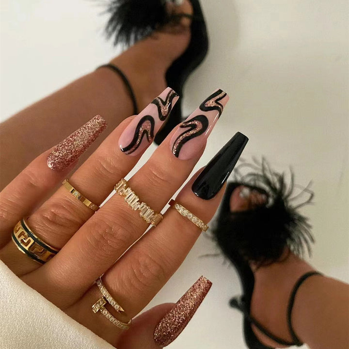 Künstlerisches Press-On-Nagelset mit Glitzer und abstrakten Designs