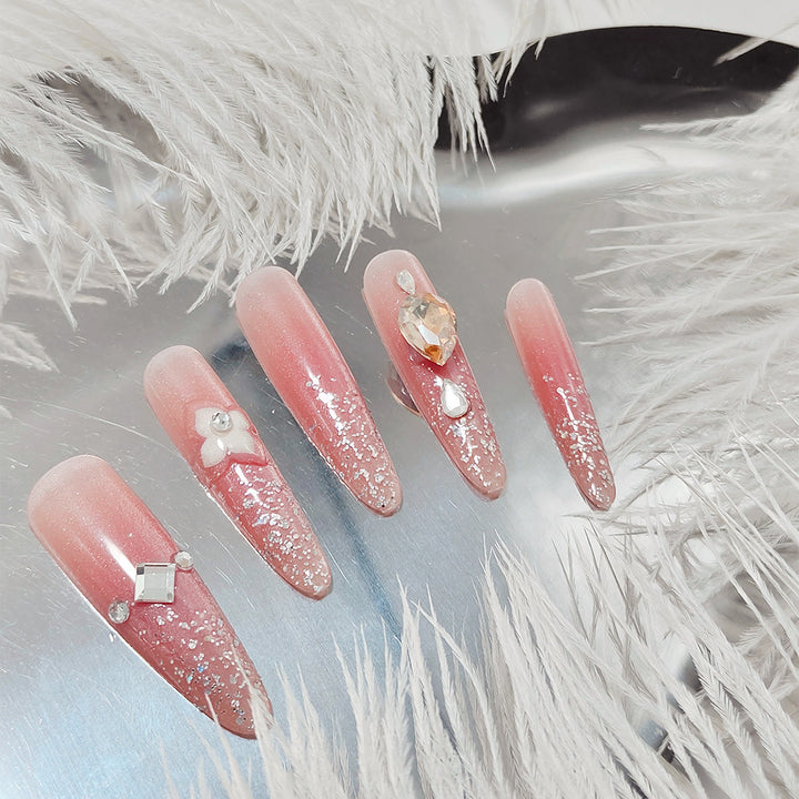 Glänzende Kunstnägel mit Strass und Glitter Karnz