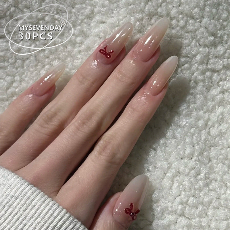 Elegante Stiletto Press-On Nägel mit dekorativen Schleifenakzenten Karnz