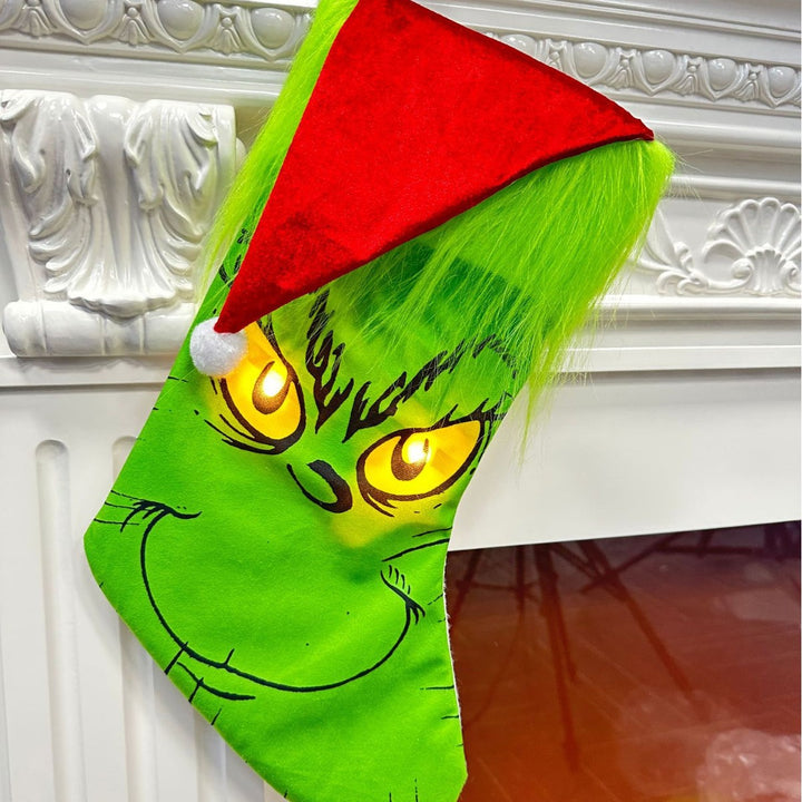 Lustiger Weihnachtsstrumpf im Grinch-Design