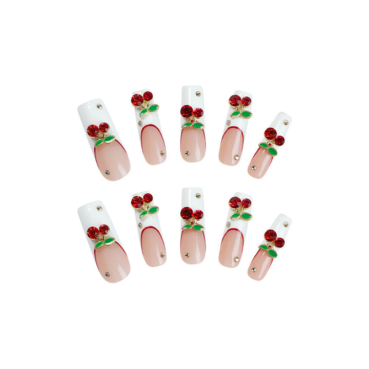 Kunstnagelset mit Kirschmotiv und funkelnden Strasssteinen Karnz