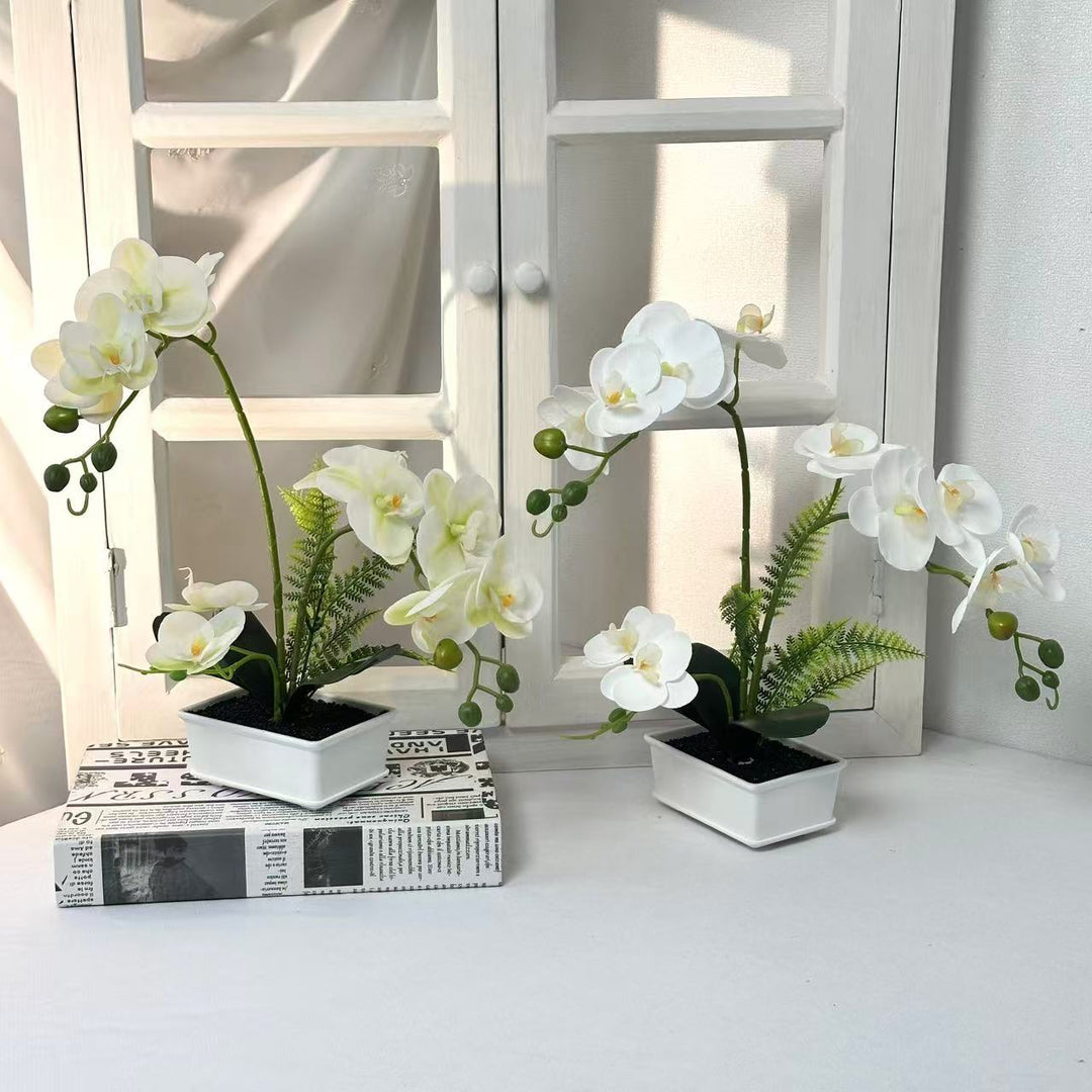 Elegante künstliche Orchideenarrangement für die Innendekoration