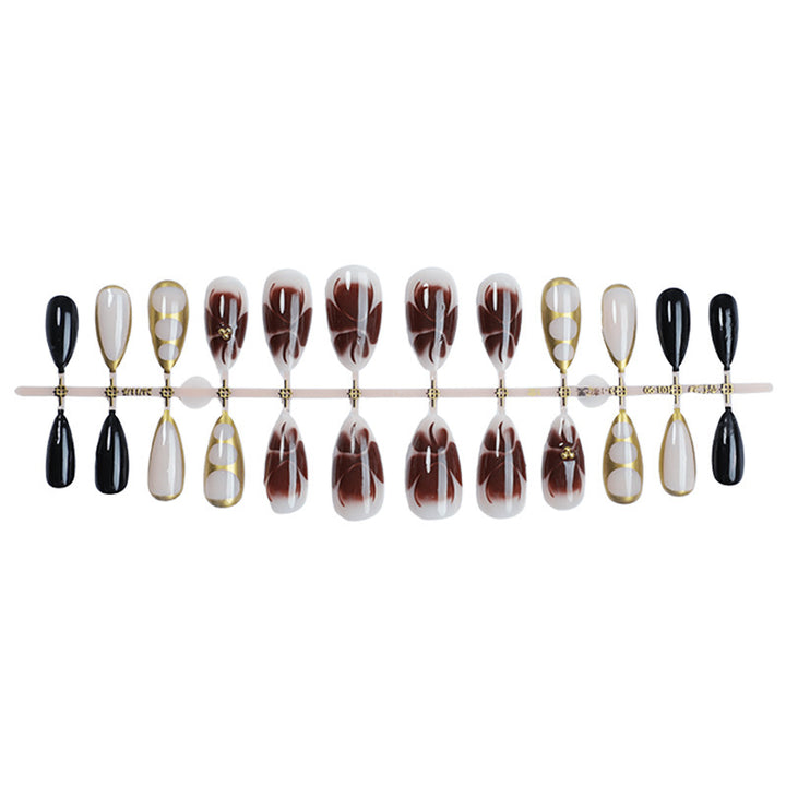 Kunstnagel-Set mit eleganten Mustern und Glitzerakzenten Karnz