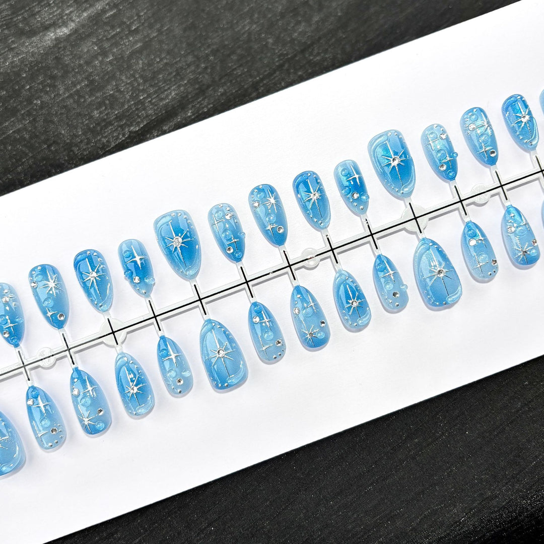Dekoratives Press-On Nagelkunstset mit Sternelementen