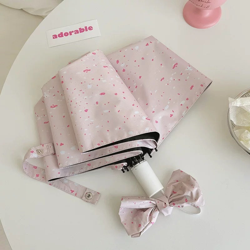 Damen eleganter Faltregenschirm mit kunstvollem Spritzmuster Karnz