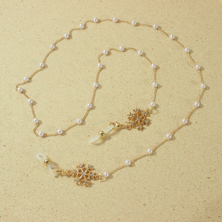 Elegante Brillenhalterkette mit Perlen und Schneeflockenanhänger Karnz