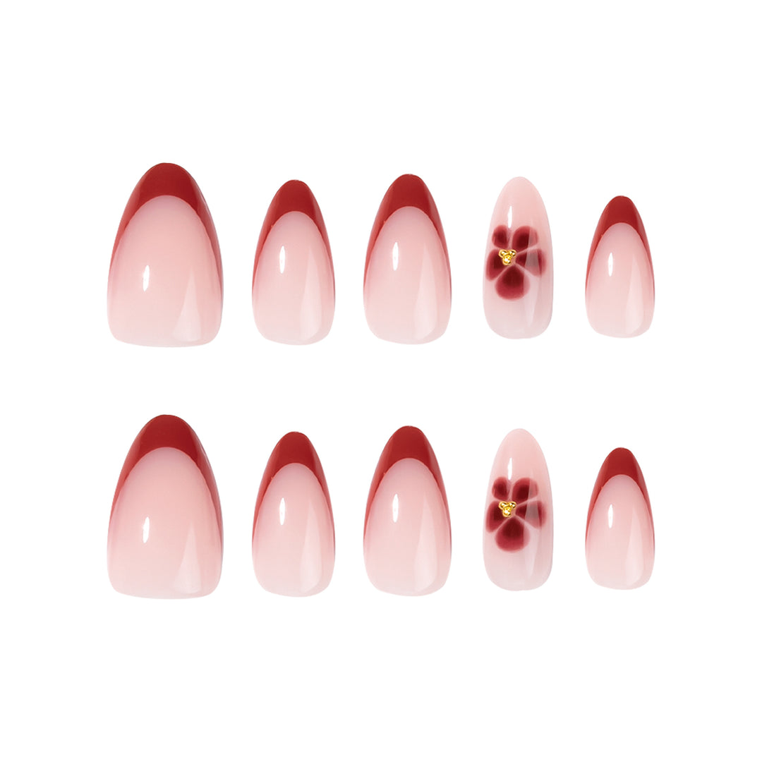 Elegante und kunstvoll gestaltete Stiletto-Nägel mit Blumendesign Karnz