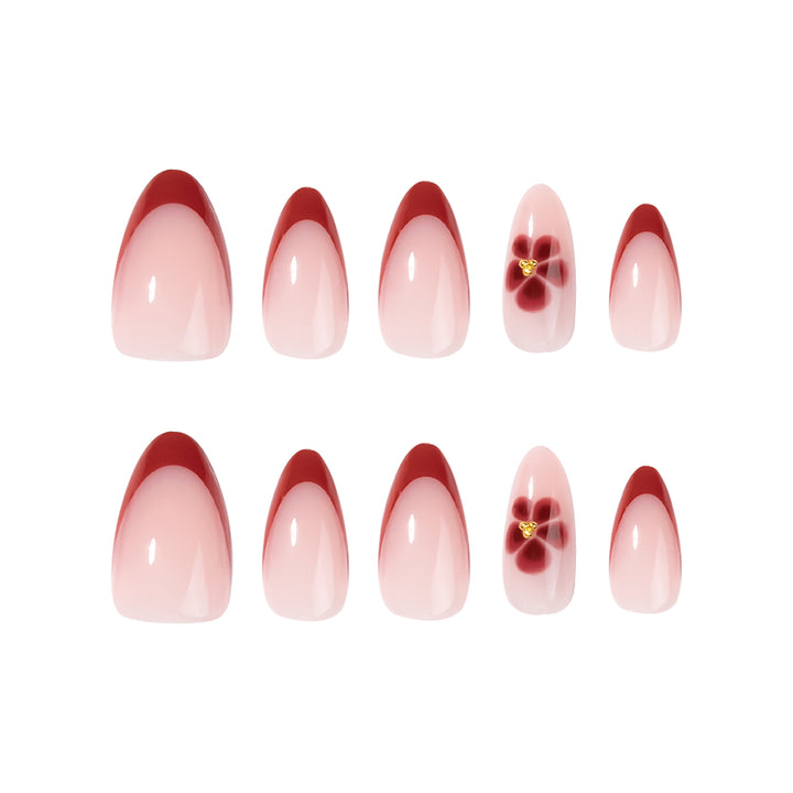 Elegante und kunstvoll gestaltete Stiletto-Nägel mit Blumendesign Karnz