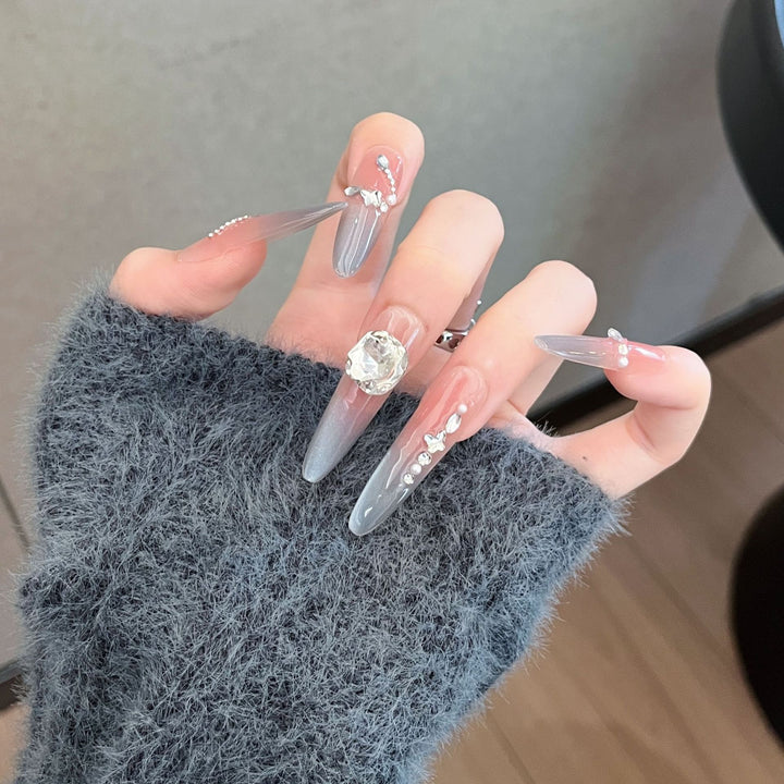 Dekorative mit Kristallen verzierte lange Stiletto Press-On Nägel Karnz
