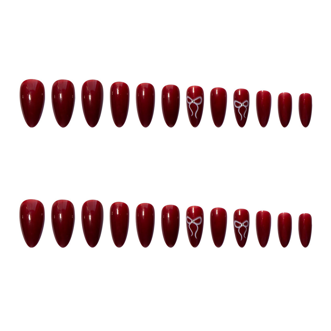 Kunstnagelset mit elegantem Bogen-Design Karnz