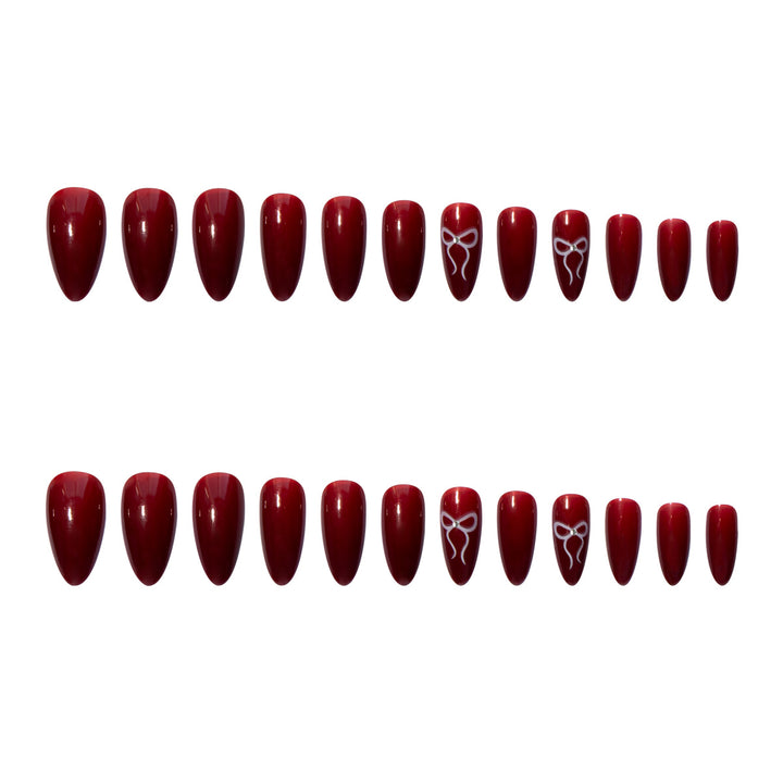 Kunstnagelset mit elegantem Bogen-Design Karnz