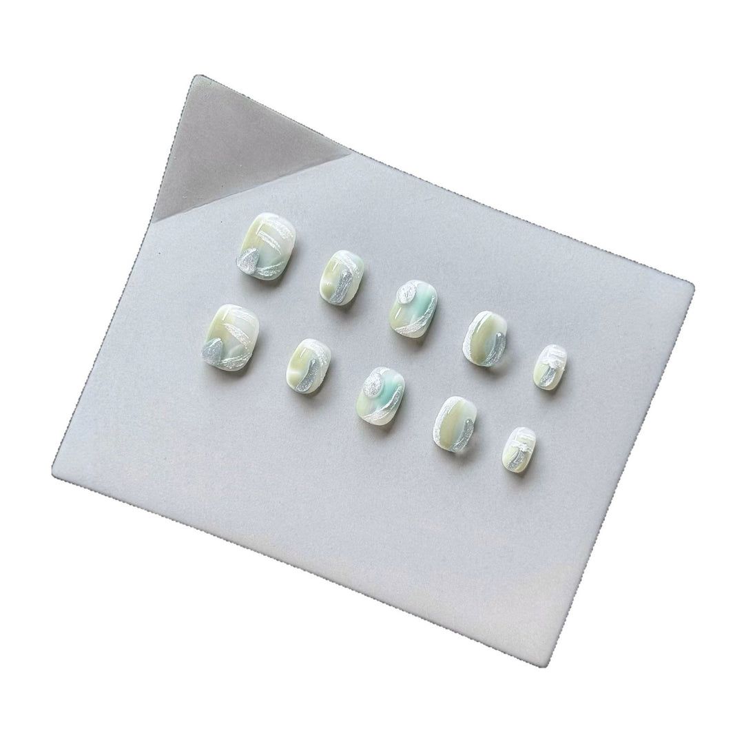 Künstlerisches Press-On-Nagelset mit glänzendem Marmor-Design