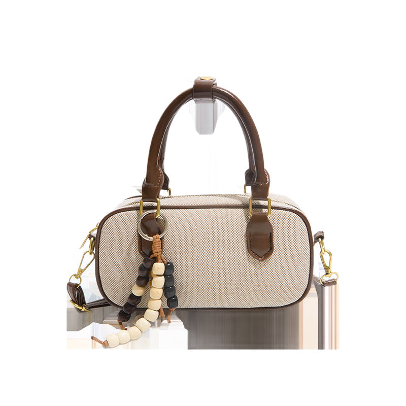 Vintage-inspirierte glänzende Handtasche