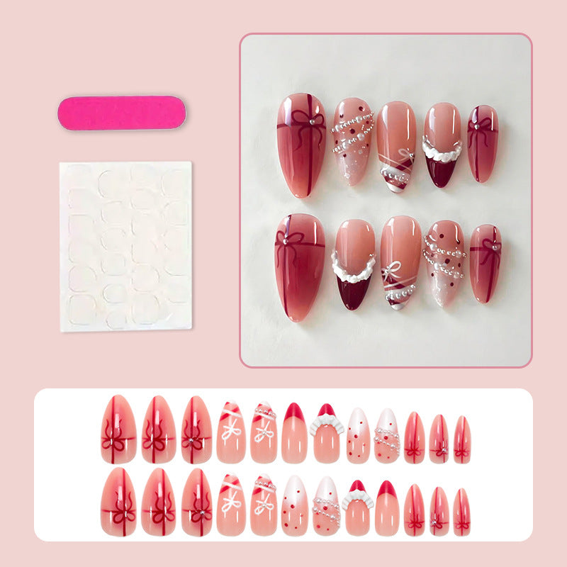 Kunstnagelset mit glamourösen Schleifen und eleganten Perlenverzierungen Karnz