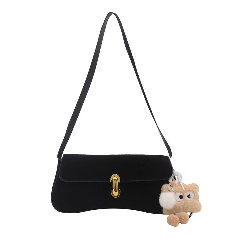 Elegante Wildleder-Handtasche mit verspieltem Schlüsselanhänger