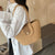 Damen Handtasche aus geflochtenem Naturmaterial mit elegantem Verschluss Karnz