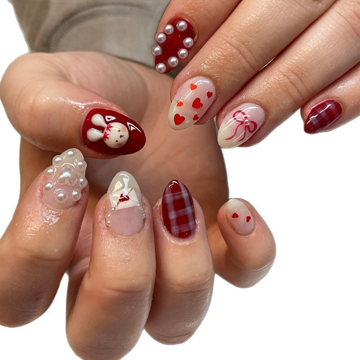 Kreatives Kunstnagelset mit niedlichen Hasen- und Herzen-Motiven Karnz