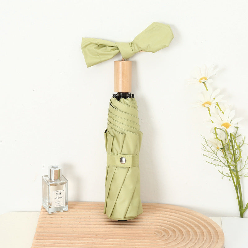 Damen kompakter Faltregenschirm mit elegantem Design und ergonomischem Holzgriff Karnz