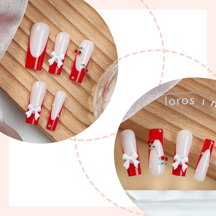 Kreatives Nagelset mit festlichen Kirschmotiven Karnz