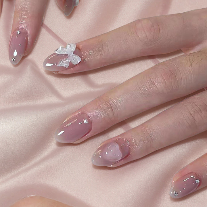 Künstlerisches Press-On Nagelset mit eleganten Schleifenakzenten Karnz