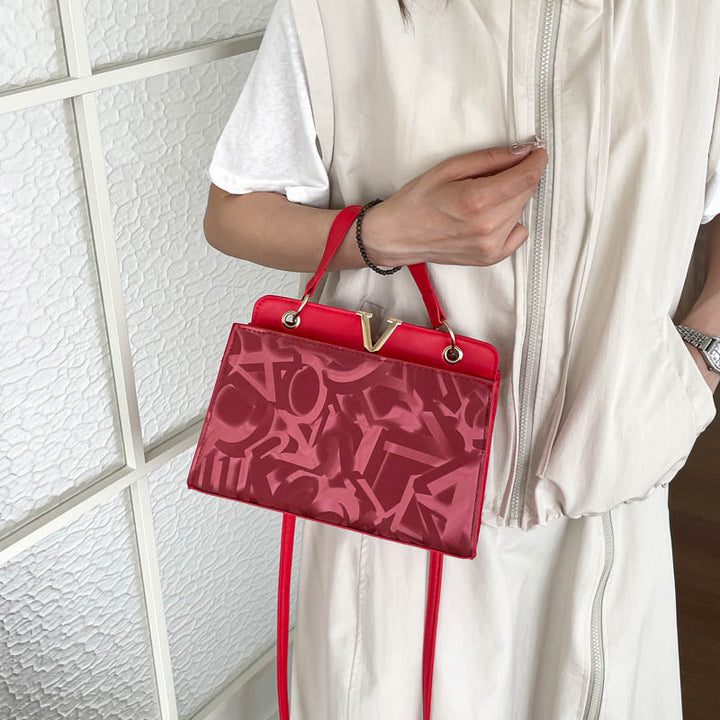 Glänzende strukturierte Handtasche