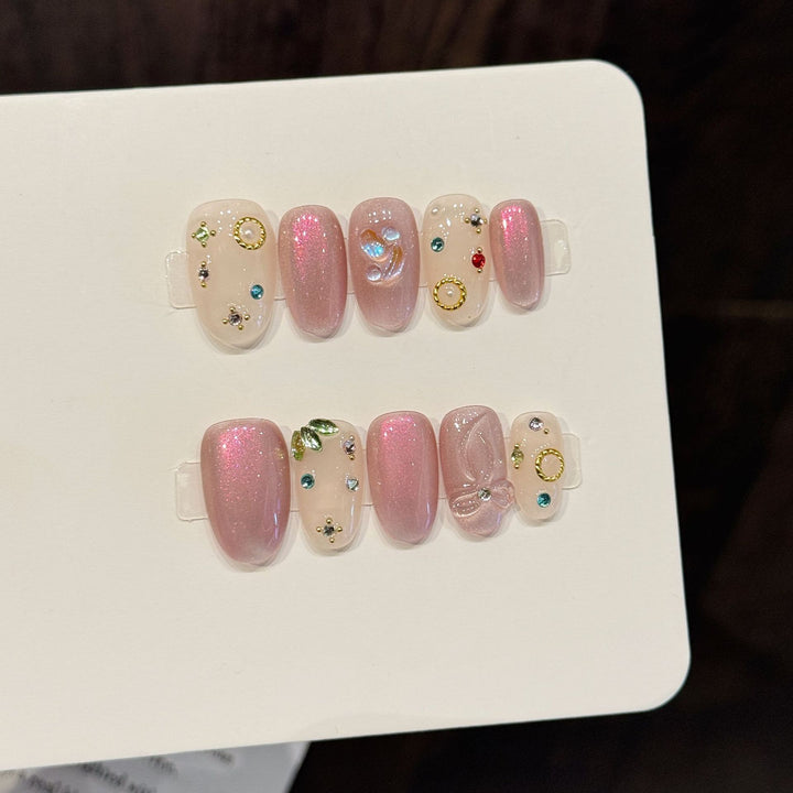 Dekoratives Press-On-Nagelkunst-Set mit einzigartigen Edelstein- und Schleifenakzenten