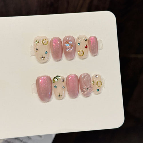 Dekoratives Press-On-Nagelkunst-Set mit einzigartigen Edelstein- und Schleifenakzenten