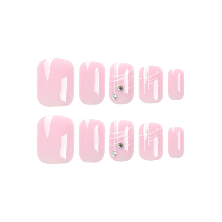 Kunstvolle Nagelverlängerungen mit elegantem Design und Strassverzierungen Karnz