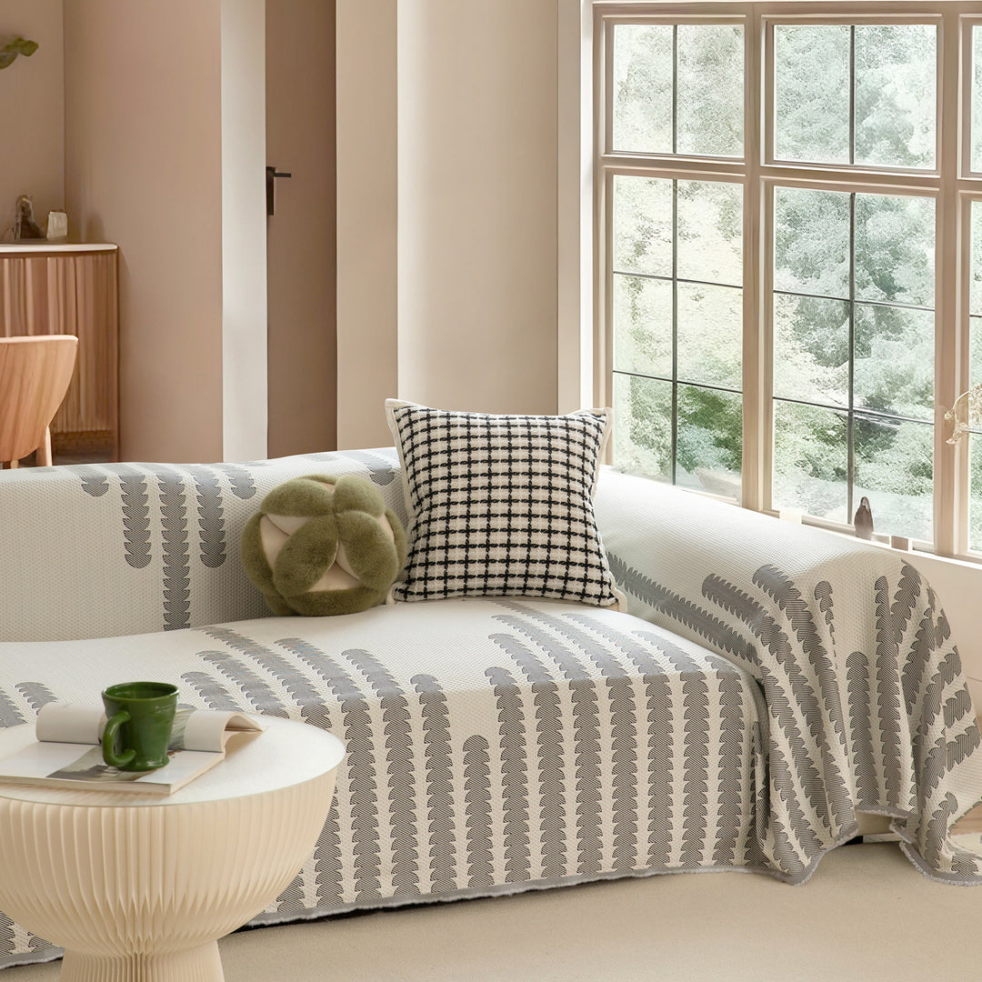 Elastischer Sofaüberwurf aus Jacquard‑Baumwollmischgewebe mit grafischem Reliefmuster