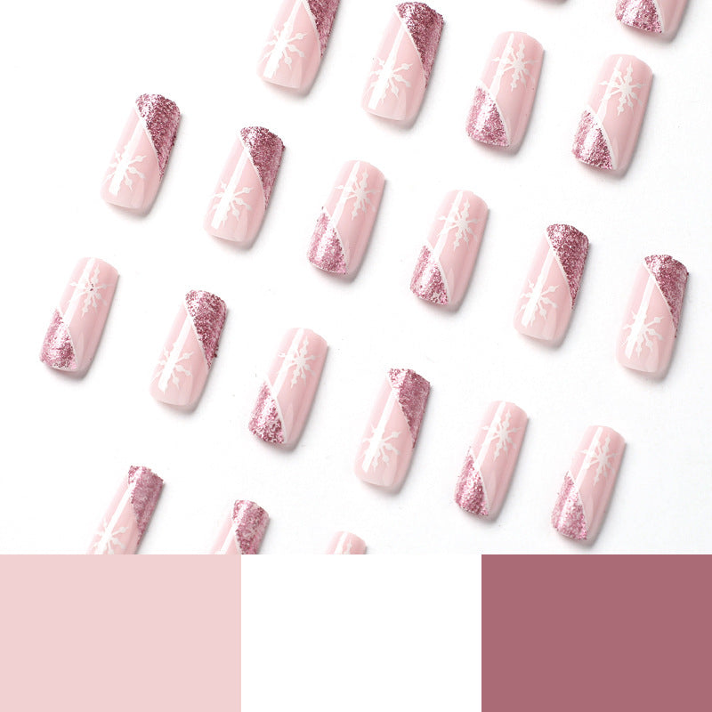 Kunstvolle Nagelverlängerungen mit festlichem Glitzer und Schneeflockendesign Karnz